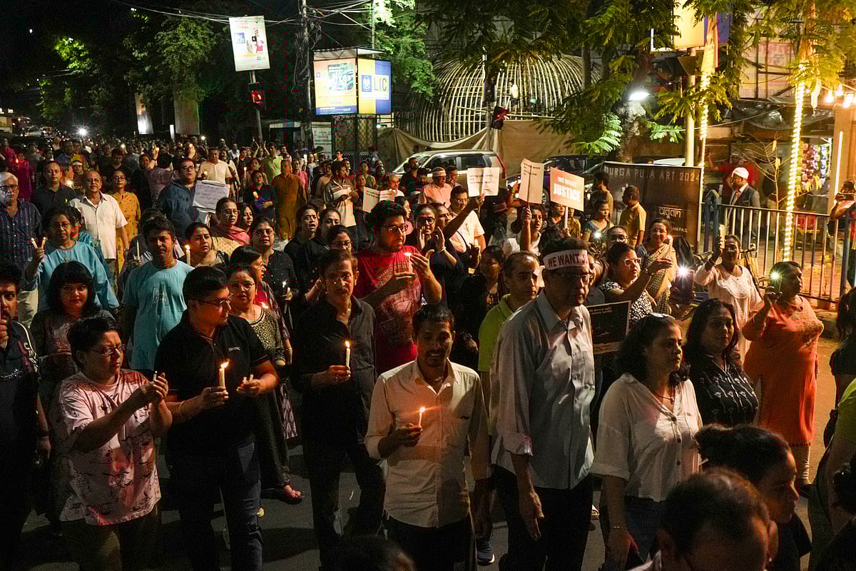 People during a candlelight march in protest against the alleged rape and murder of a trainee woman doctor at the RG Kar Medical College and Hospital, in Kolkata, Wednesday - PTI